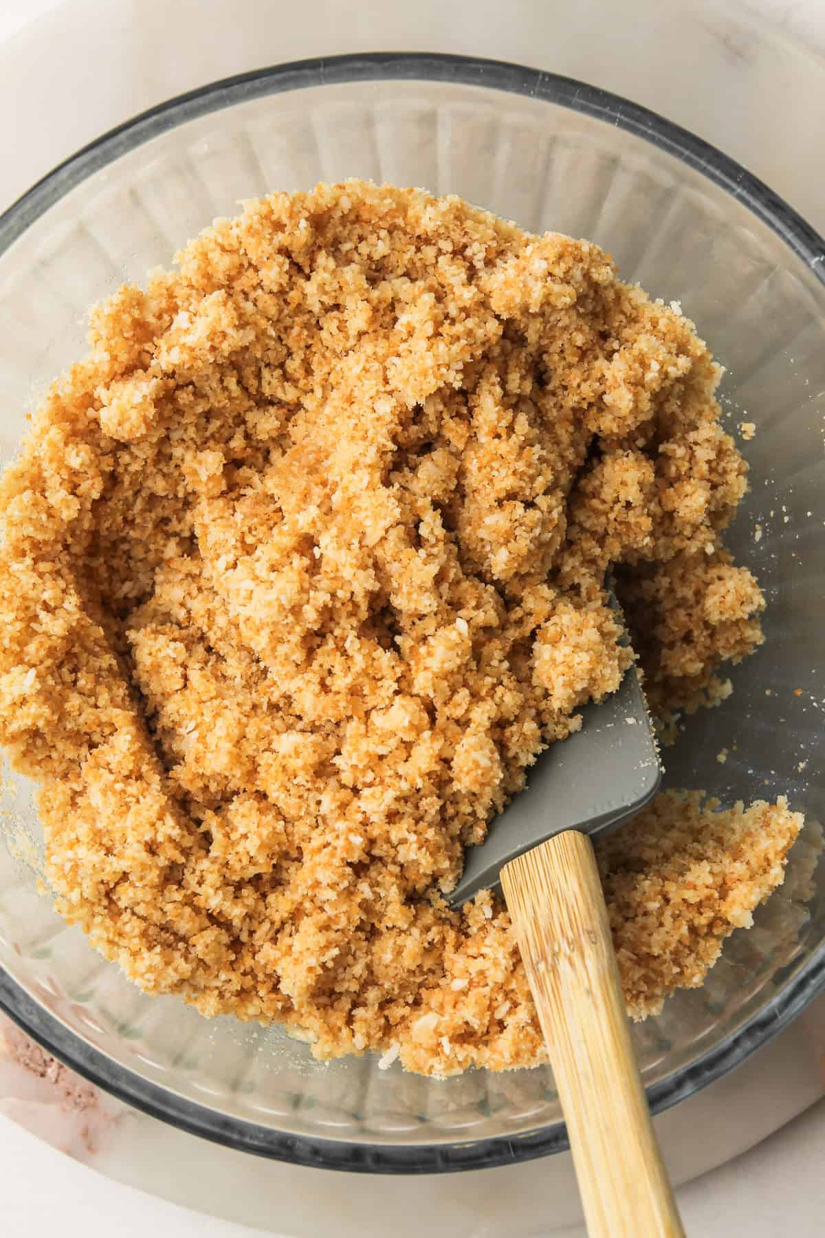 Crust mixture fully combined and ready to be pressed into the pan.