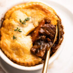A beef pot pie in a mini dish.