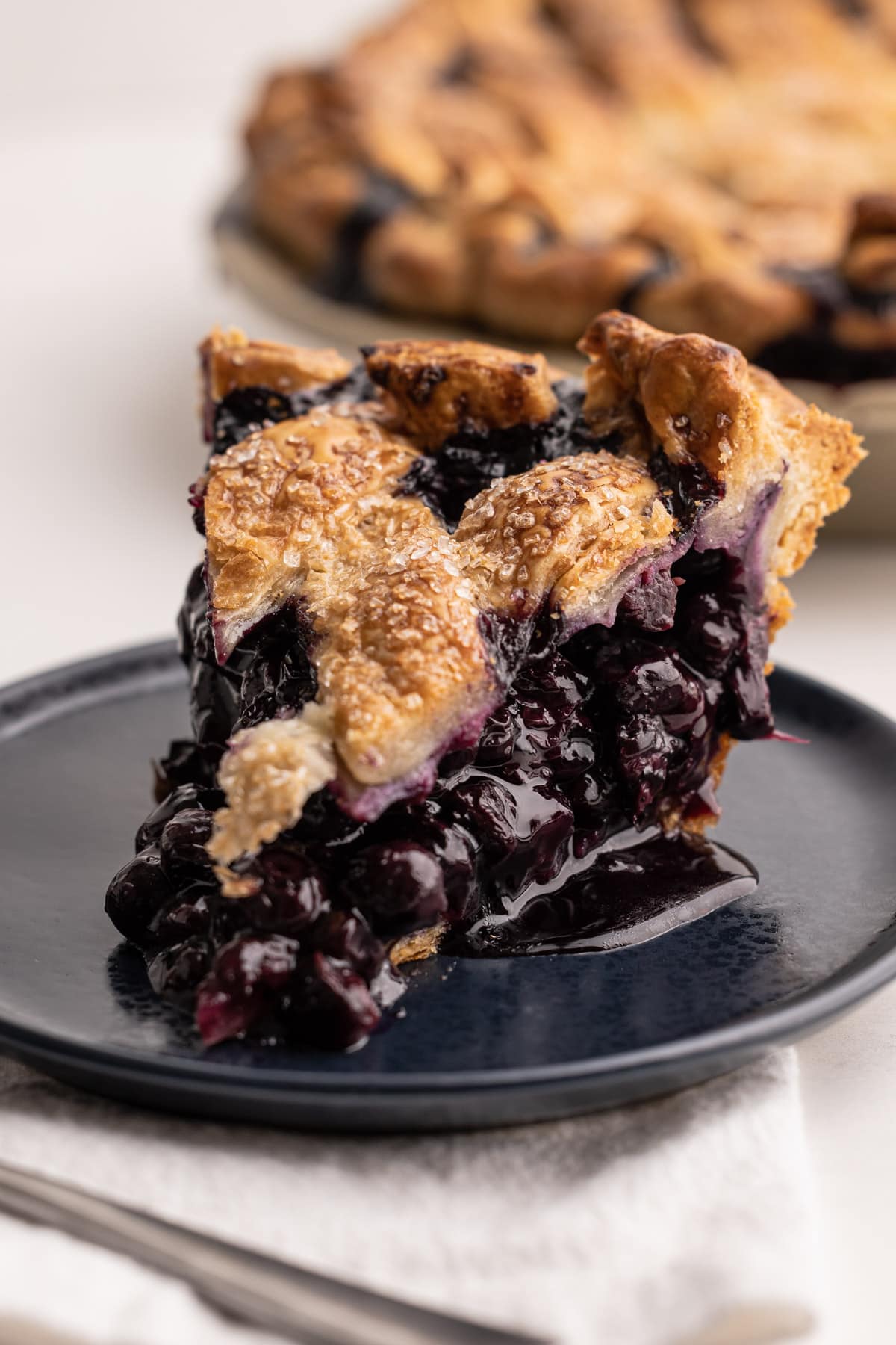 A baked blueberry pie.