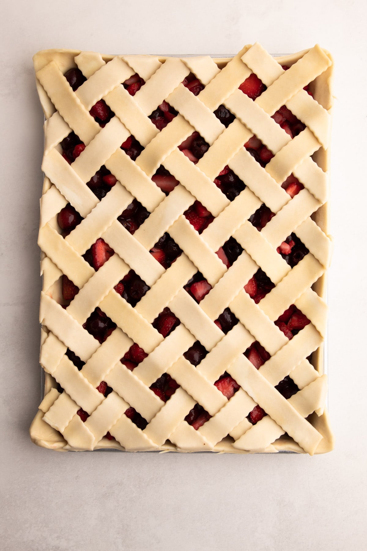 A lattice weaved on a slab pie.