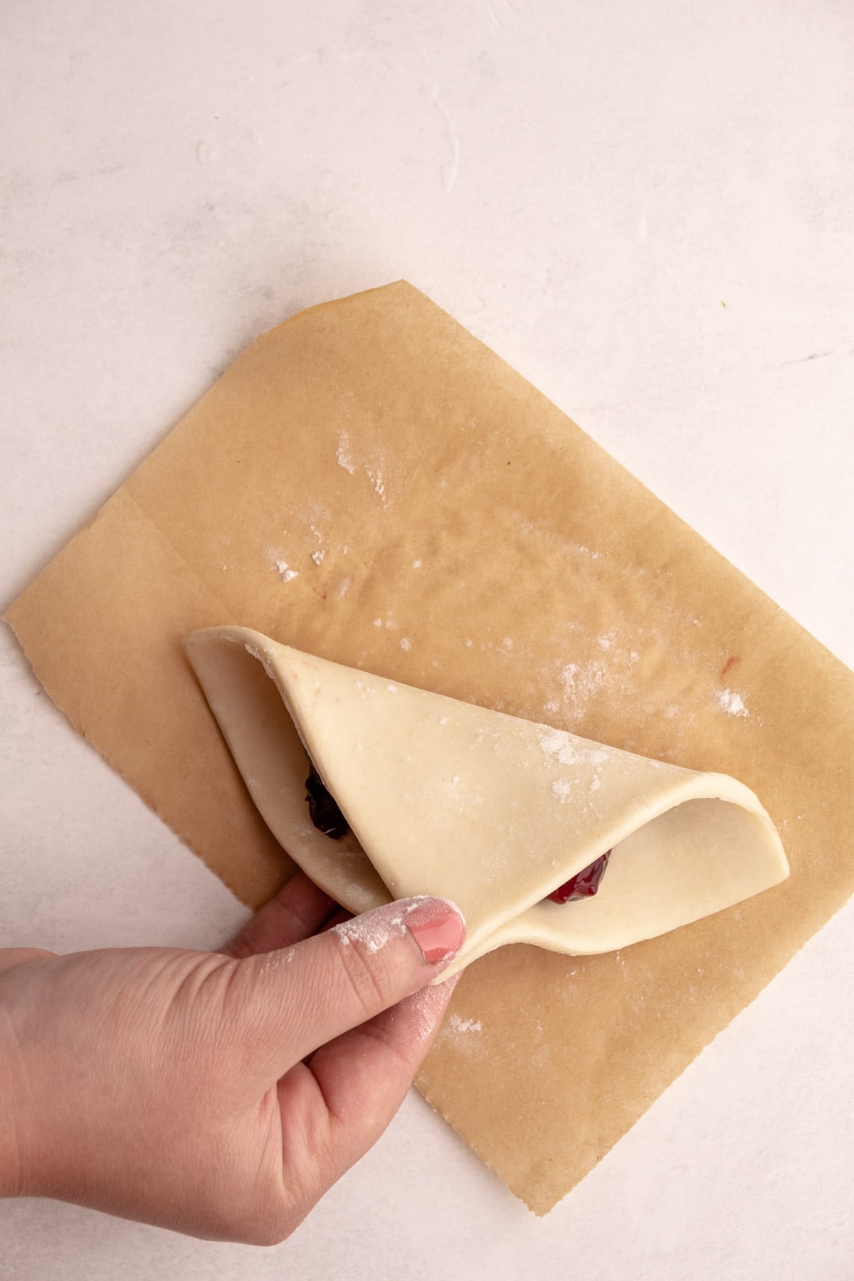 Folding up a turnover.