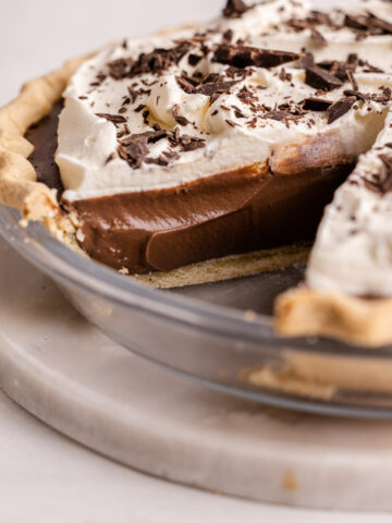 A sliced chocolate cream pie.
