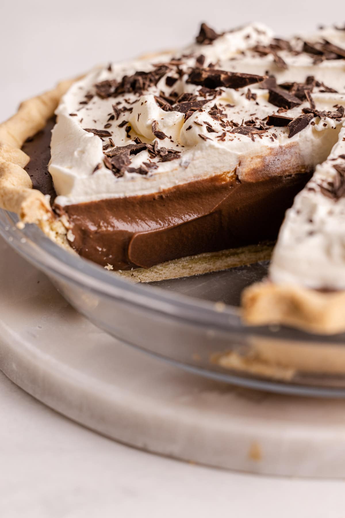 A sliced chocolate cream pie.