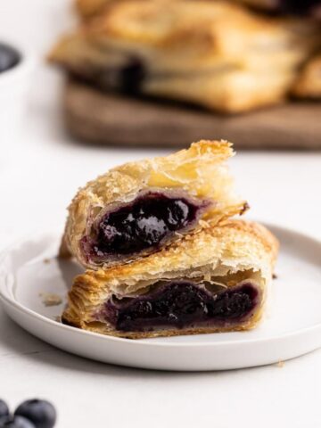 Blueberry Turnovers sliced in half to reveal the filling.