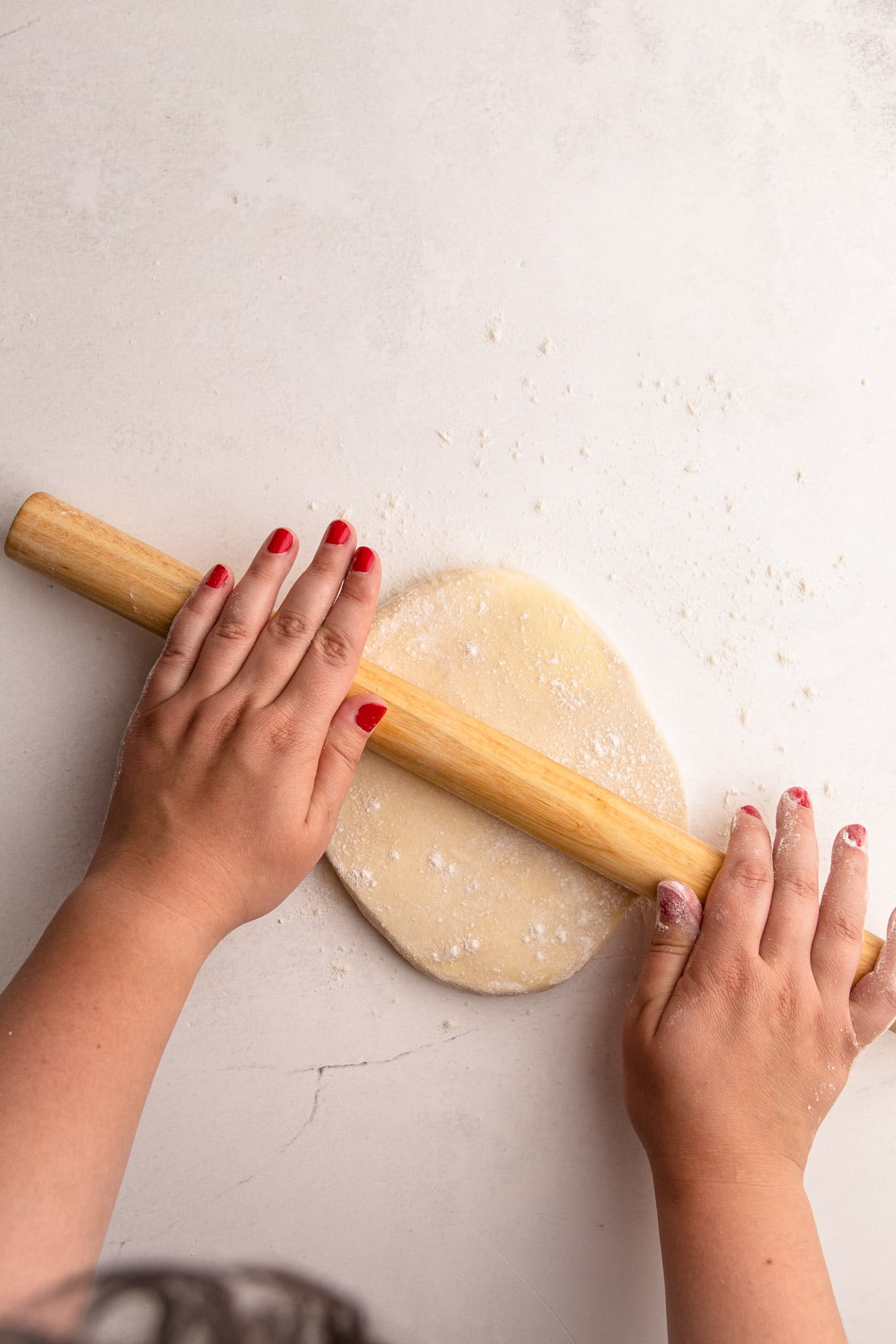 Rolling out pie crust.