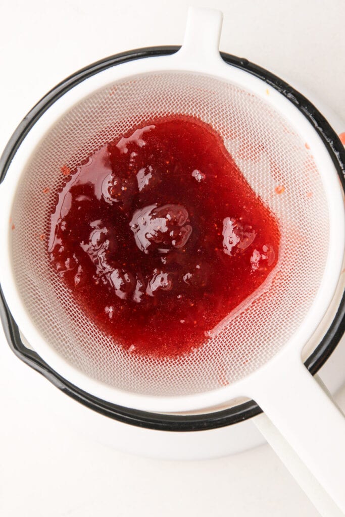 Making strawberry glaze for fresh strawberry pie.