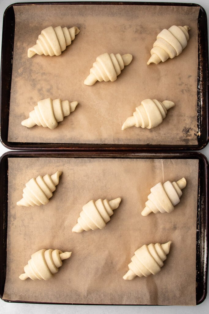 Croissants on a sheet tray.