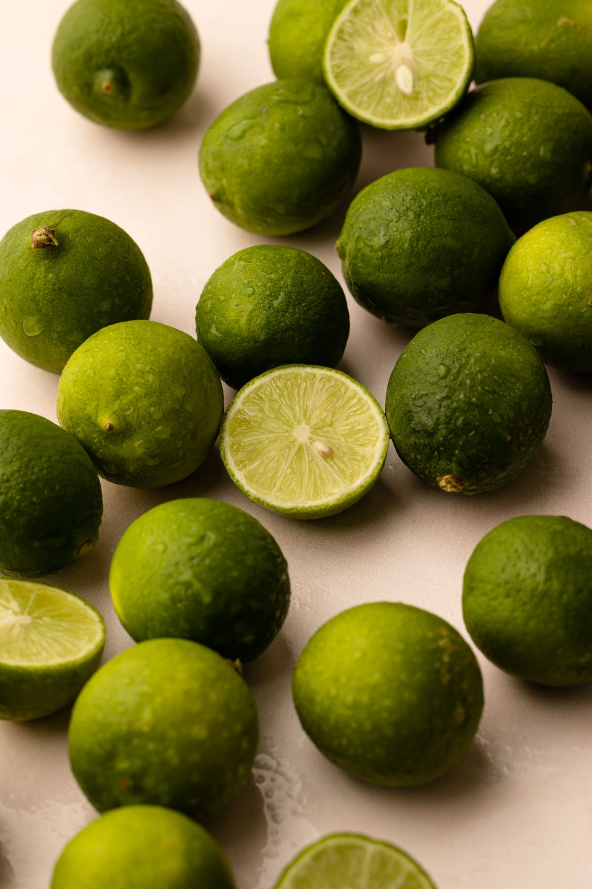A bunch of key limes cut in half.