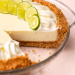 A key lime pie with whipped cream on top.