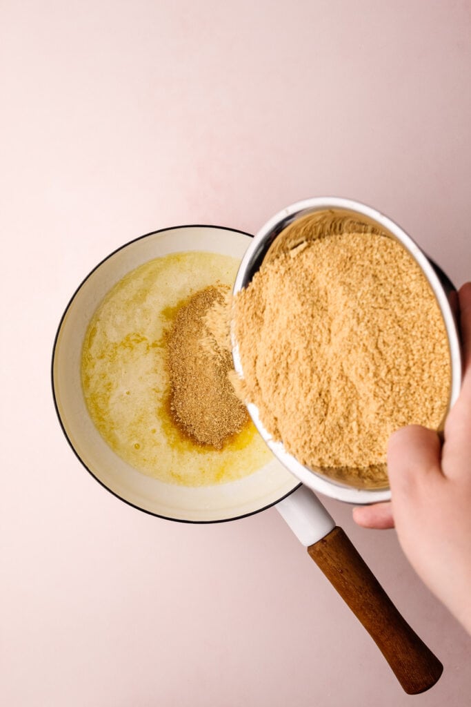Making a graham cracker pie crust.