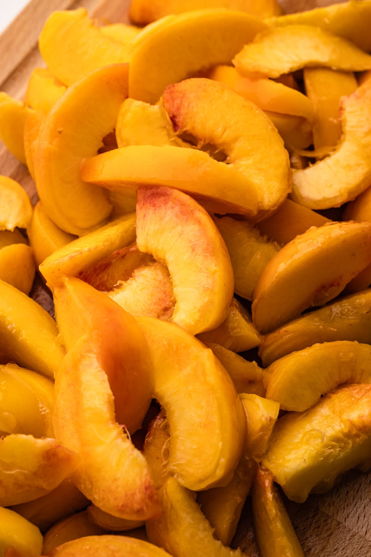 A bunch of peaches cut for pie.