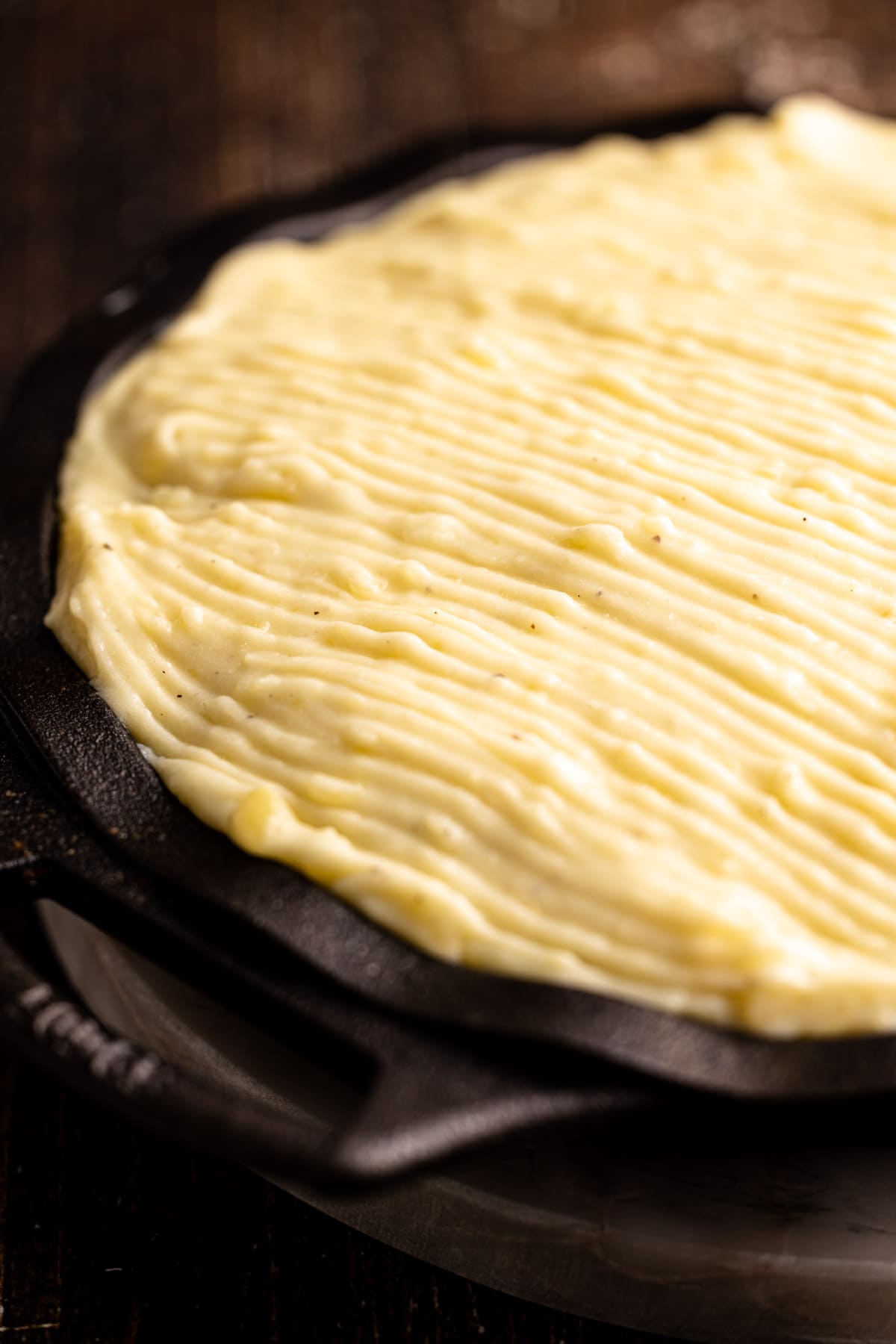 An assembled but unbaked beef shepherds pie.