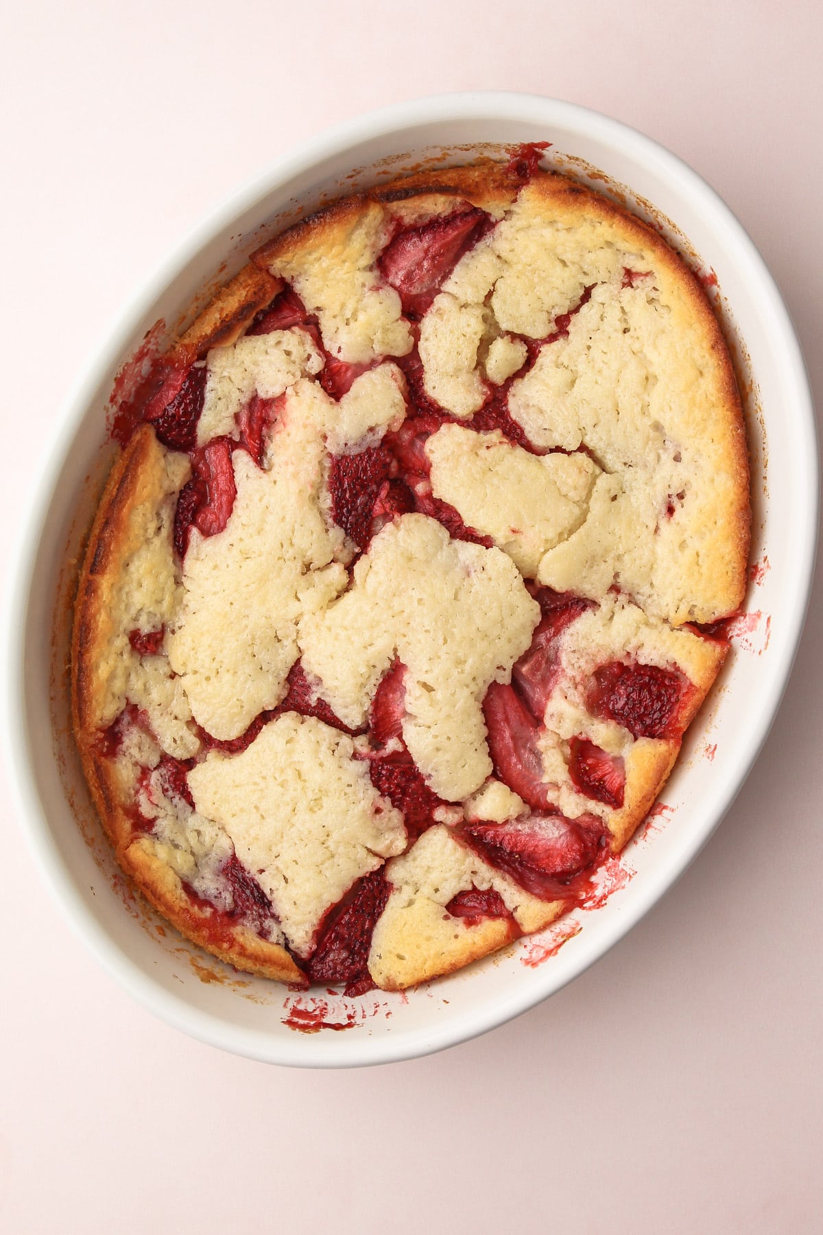 A fully baked strawberry cobbler.