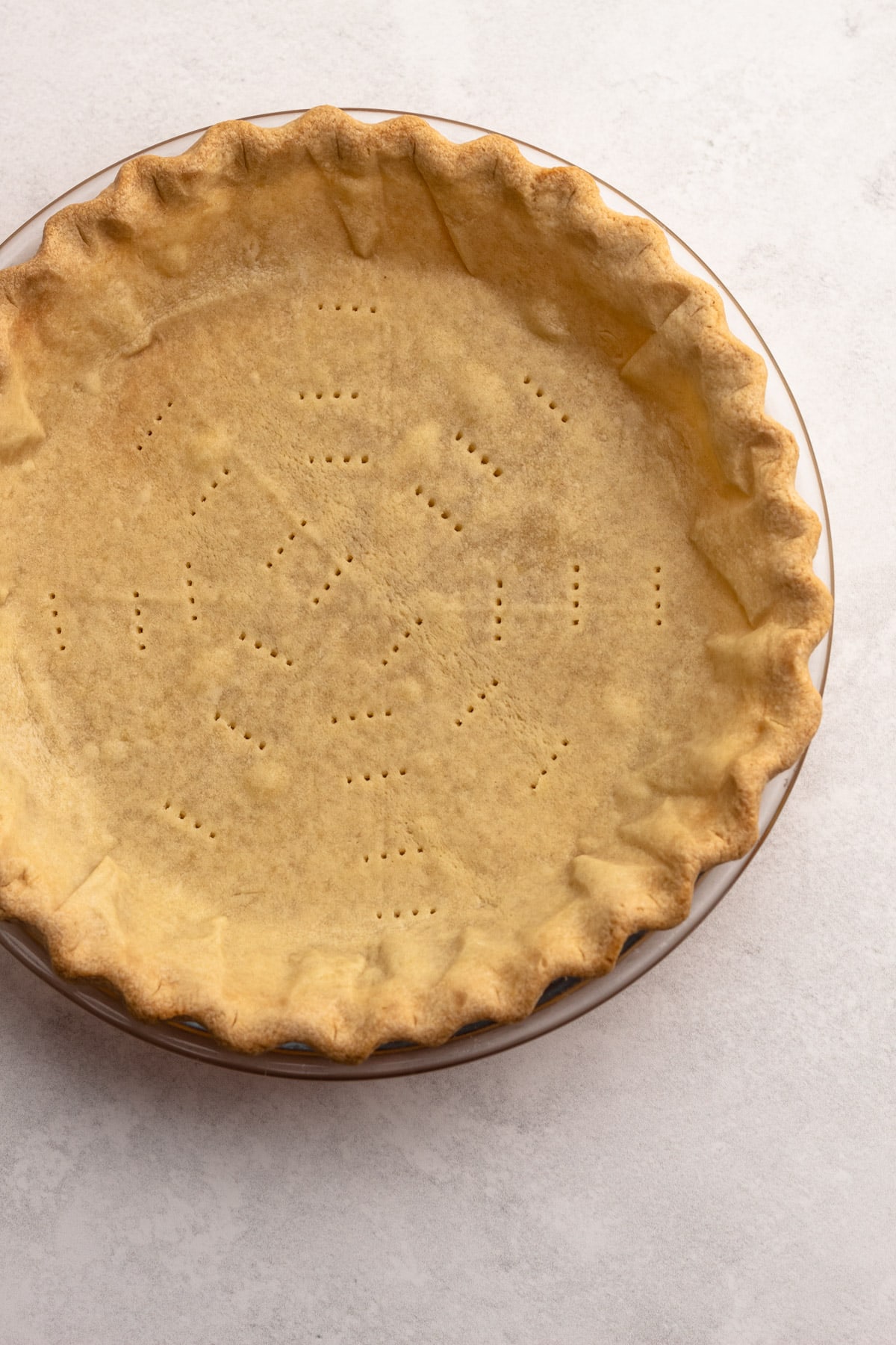 A sweet pie crust fully blind baked.