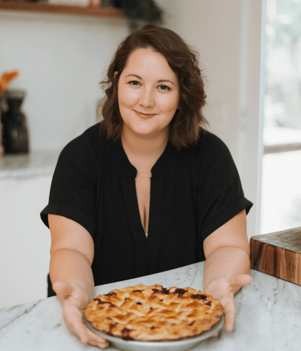 Kelli Avila, creator of Everyday Pie standing in a kitchen.